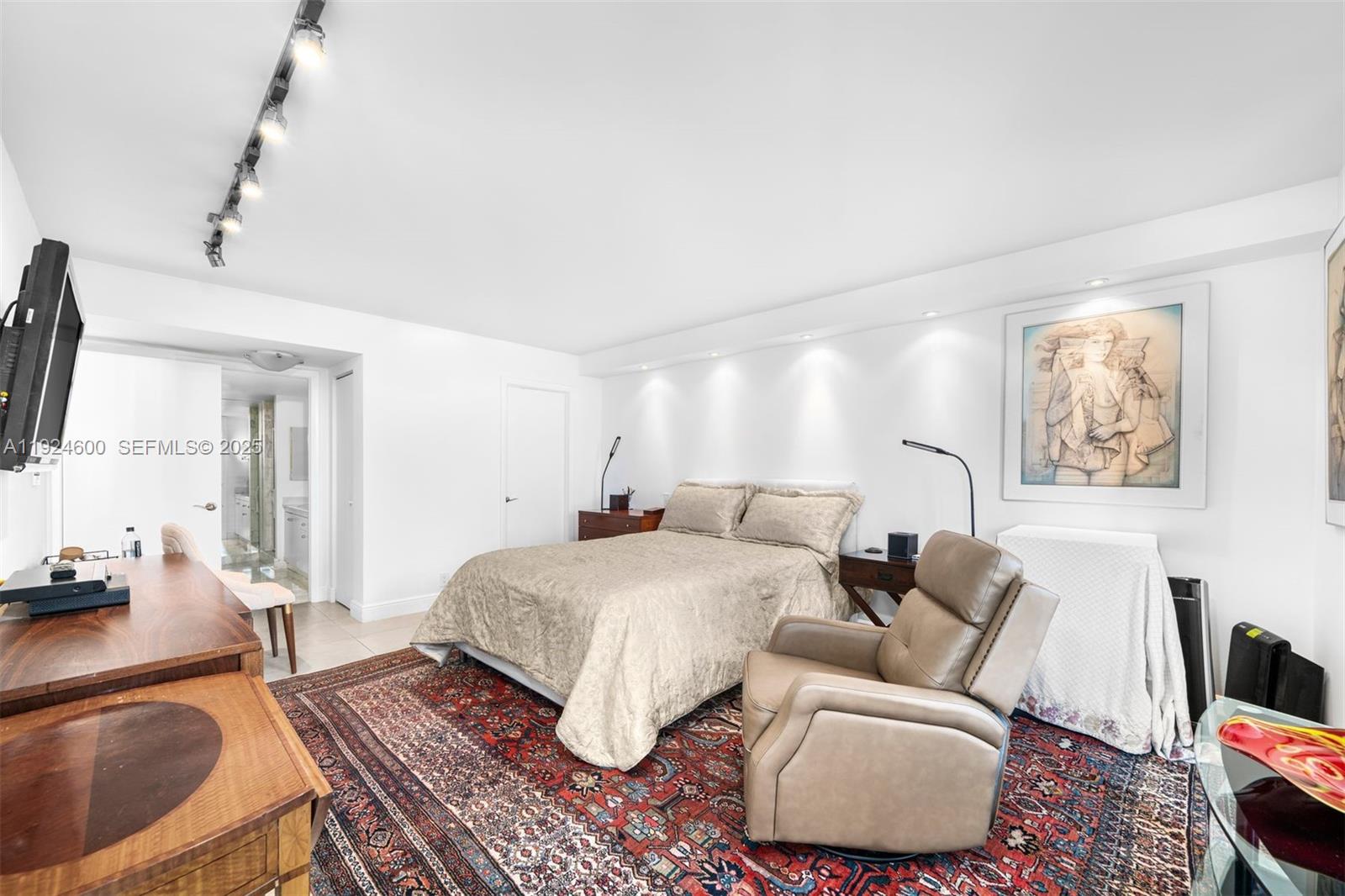 4000 Towerside Terrace, Unit 705 Miami, FL 33138 - Photo 20 of 42 a living room with furniture and a flat screen tv