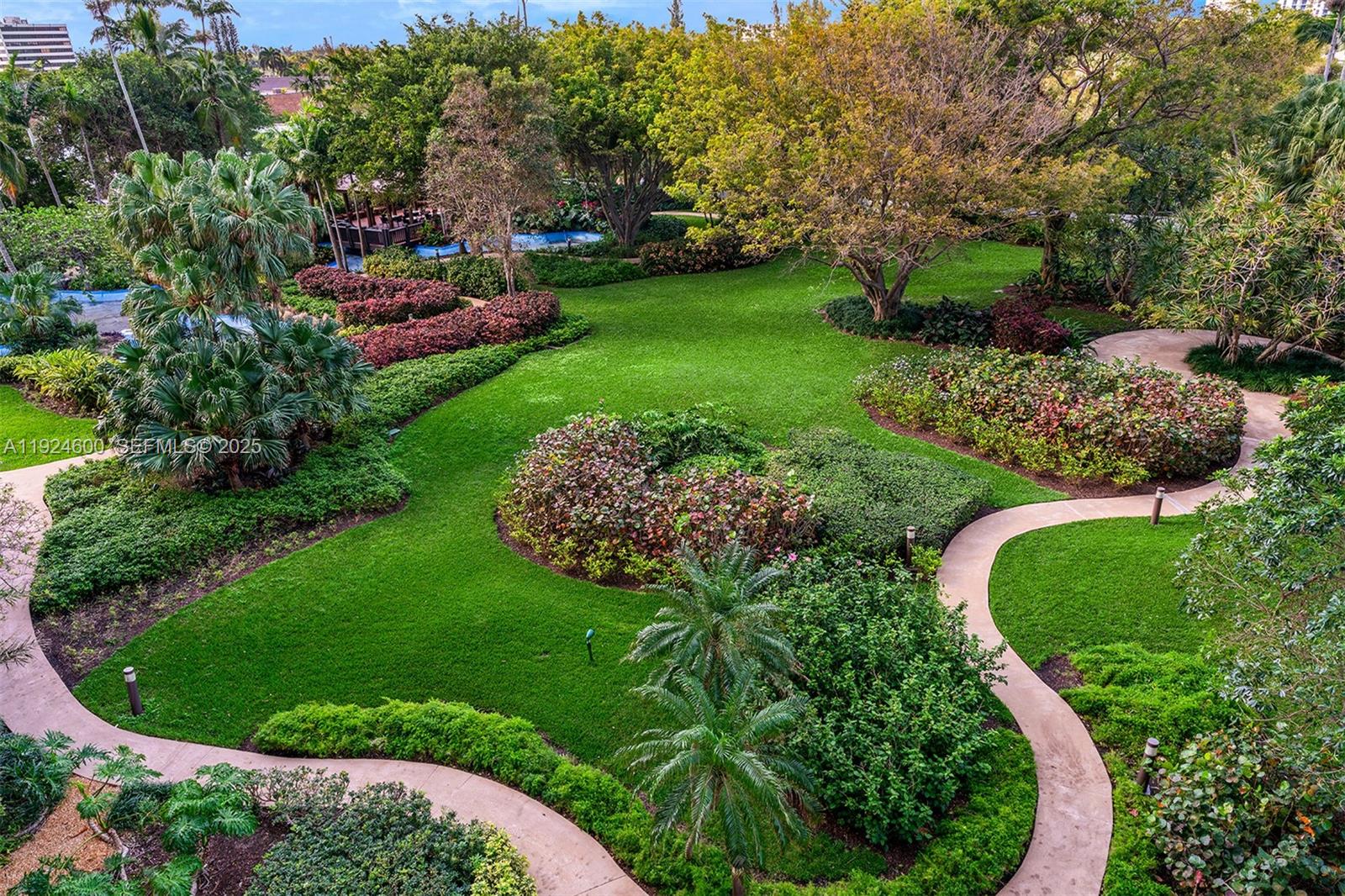 4000 Towerside Terrace, Unit 705 Miami, FL 33138 - Photo 2 of 42 a view of a garden with plants and trees