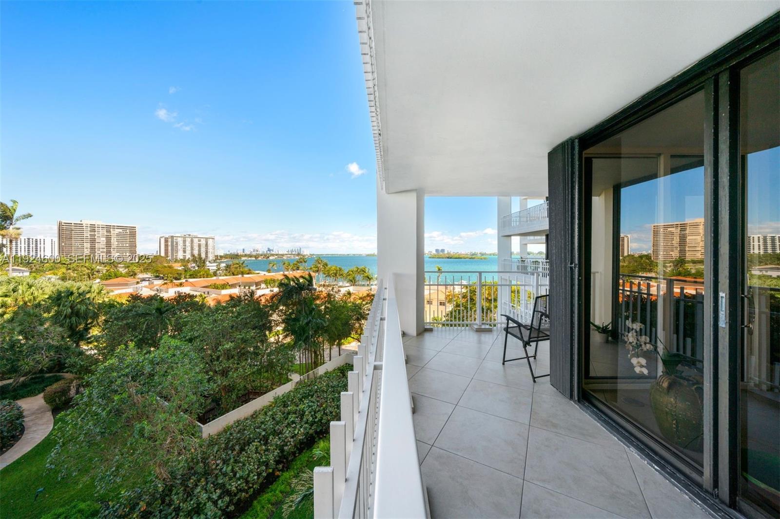 4000 Towerside Terrace, Unit 705 Miami, FL 33138 - Photo 30 of 42 a view of a balcony with lake view and a floor to ceiling window