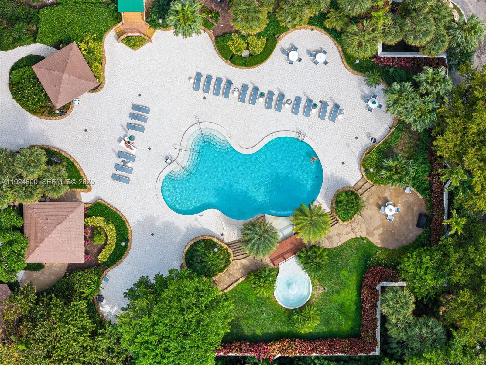 4000 Towerside Terrace, Unit 705 Miami, FL 33138 - Photo 31 of 42 an aerial view of a swimming pool patio and outdoor seating