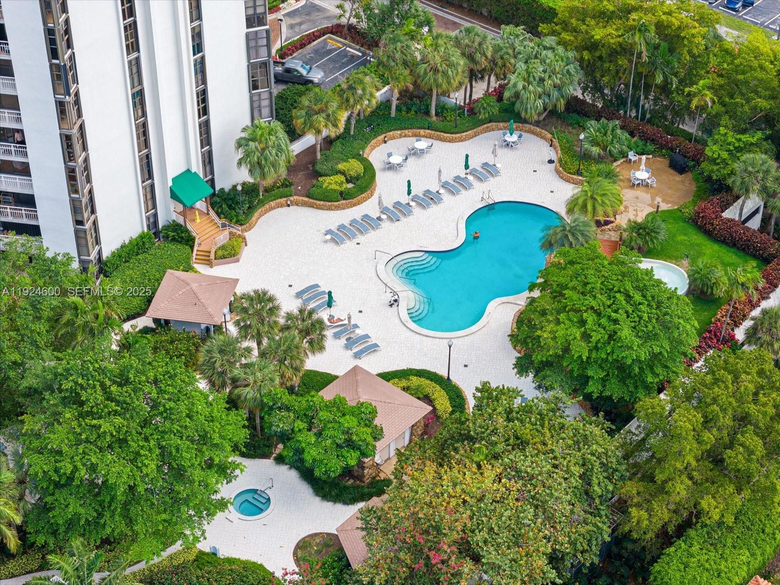 4000 Towerside Terrace, Unit 705 Miami, FL 33138 - Photo 32 of 42 an aerial view of a house with a garden and swimming pool