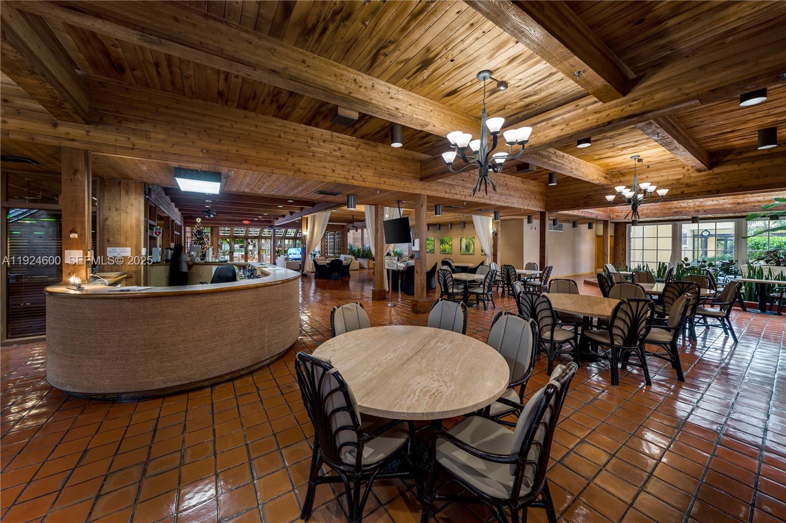 4000 Towerside Terrace, Unit 705 Miami, FL 33138 - Photo 41 of 42 a view of a dining room with furniture