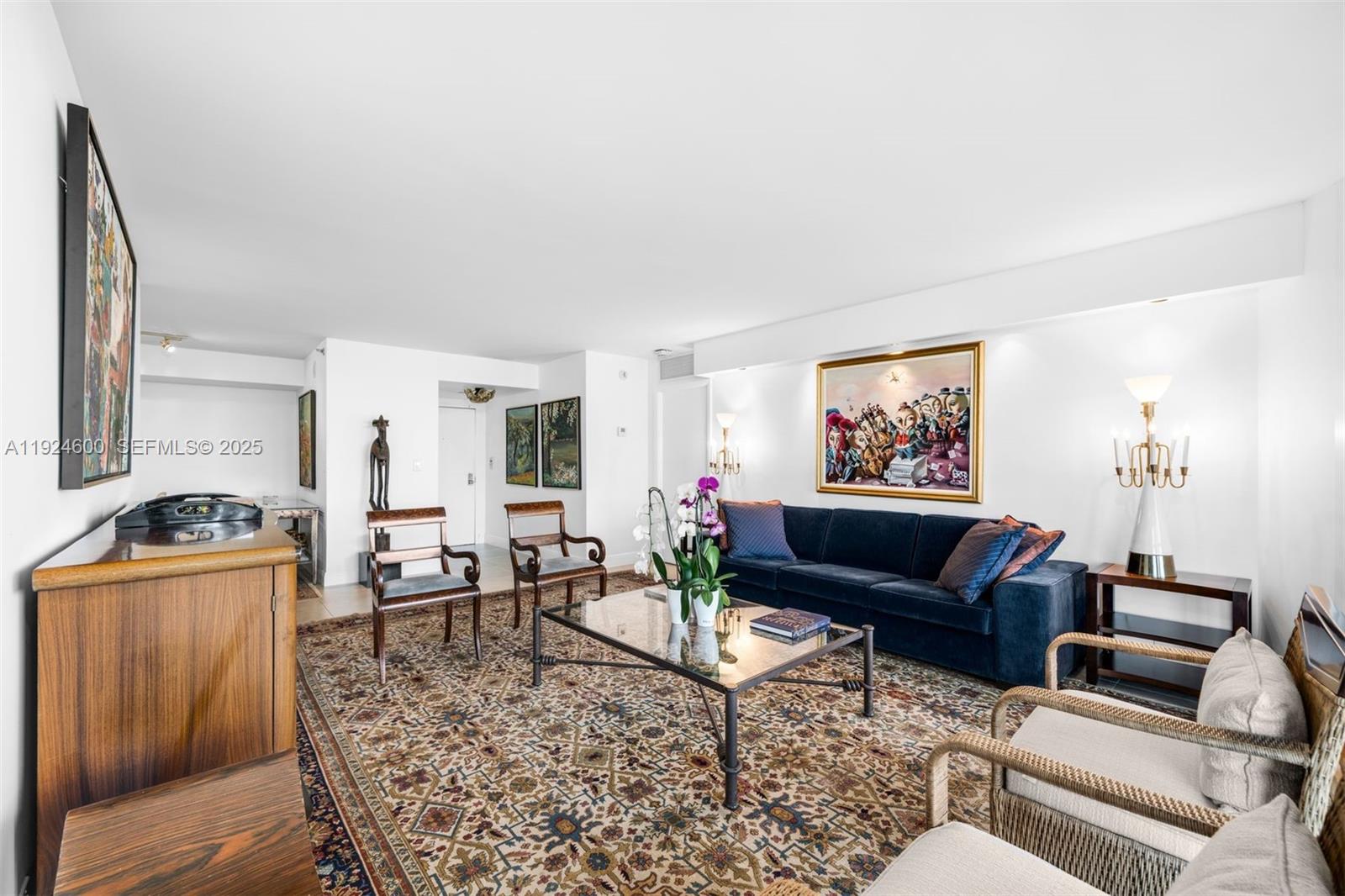 4000 Towerside Terrace, Unit 705 Miami, FL 33138 - Photo 6 of 42 a living room with furniture and a couch