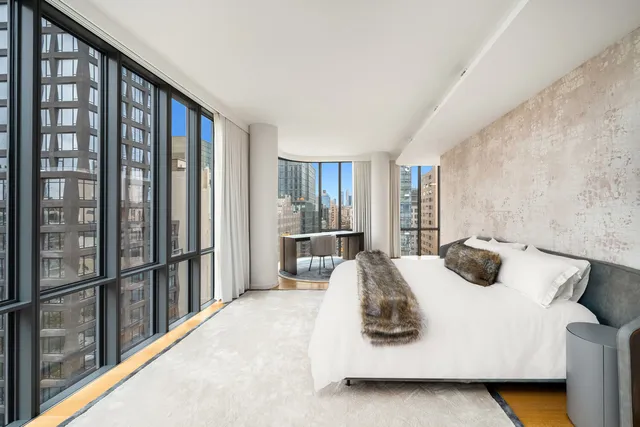 a living room with furniture fireplace and flat screen tv