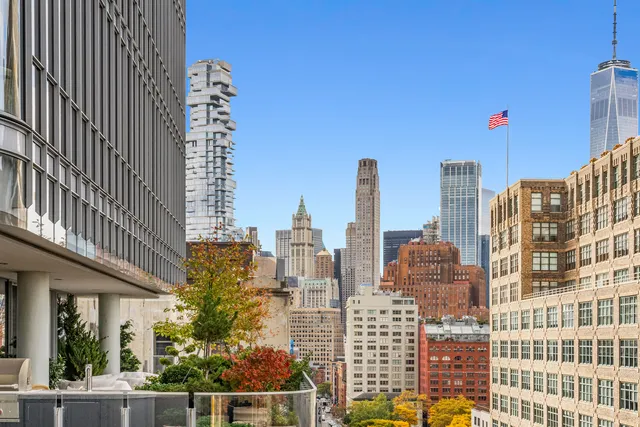 a view of a patio with couches and potted plants