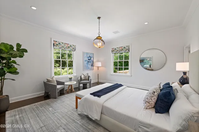 a bedroom with bed and a window