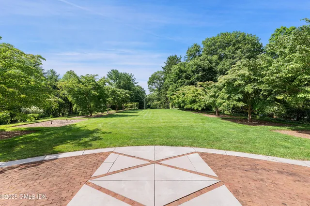 an aerial view of residential house with outdoor space and street view