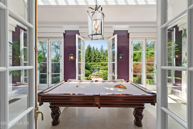 a view of a room with a large window and table