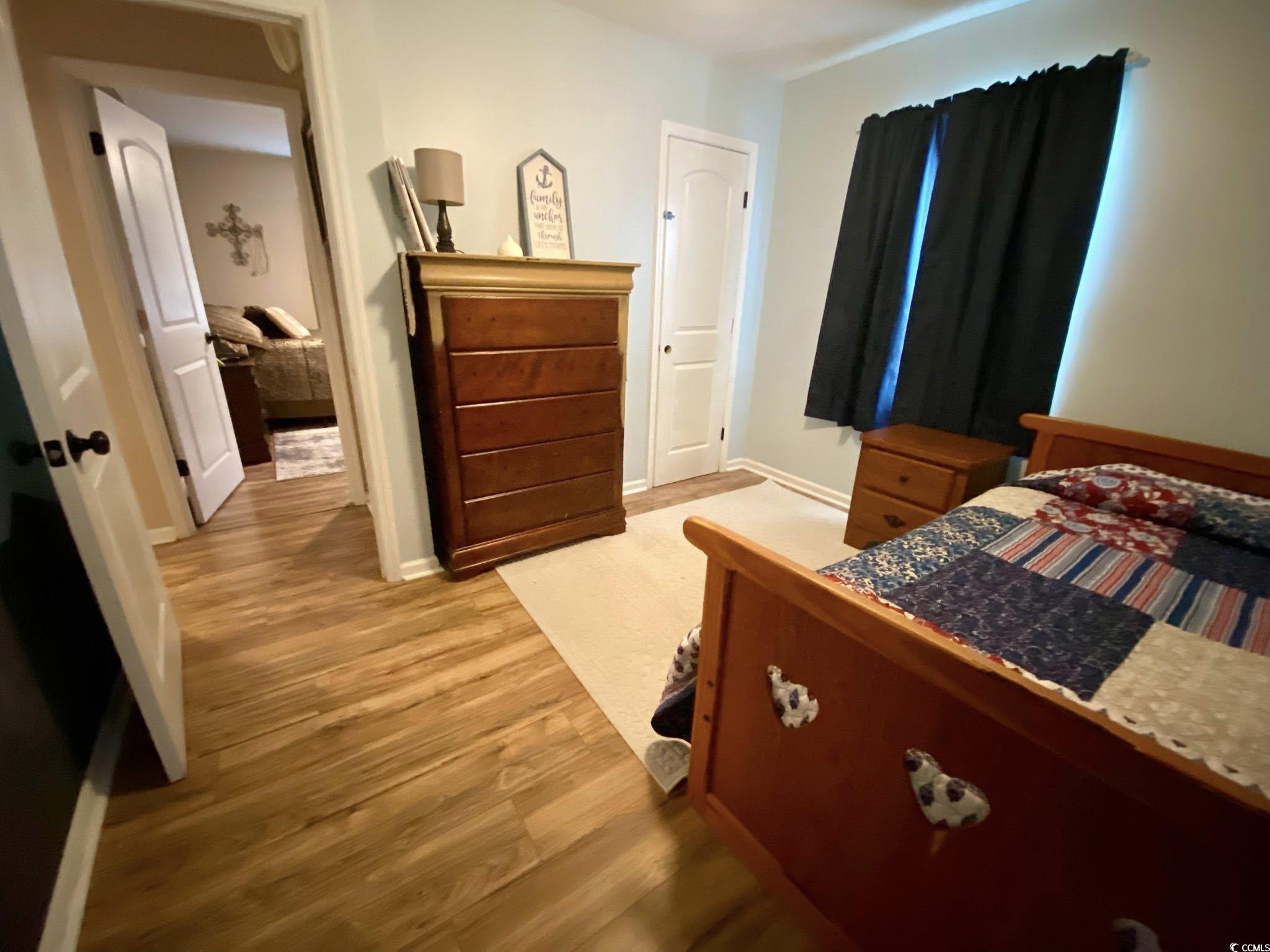 512 South Hazel Avenue Andrews, SC 29510 - Photo 12 of 15 Bedroom with light wood-type flooring and baseboar