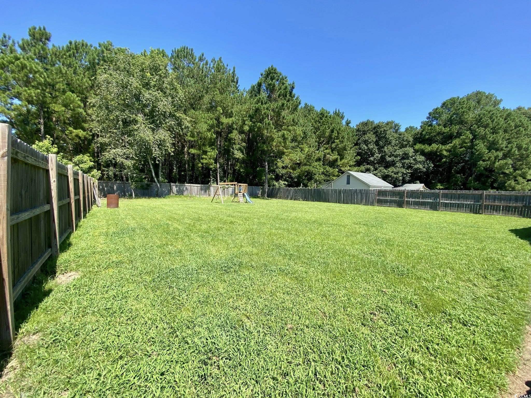 512 South Hazel Avenue Andrews, SC 29510 - Photo 15 of 15 Fenced backyard with a playground
