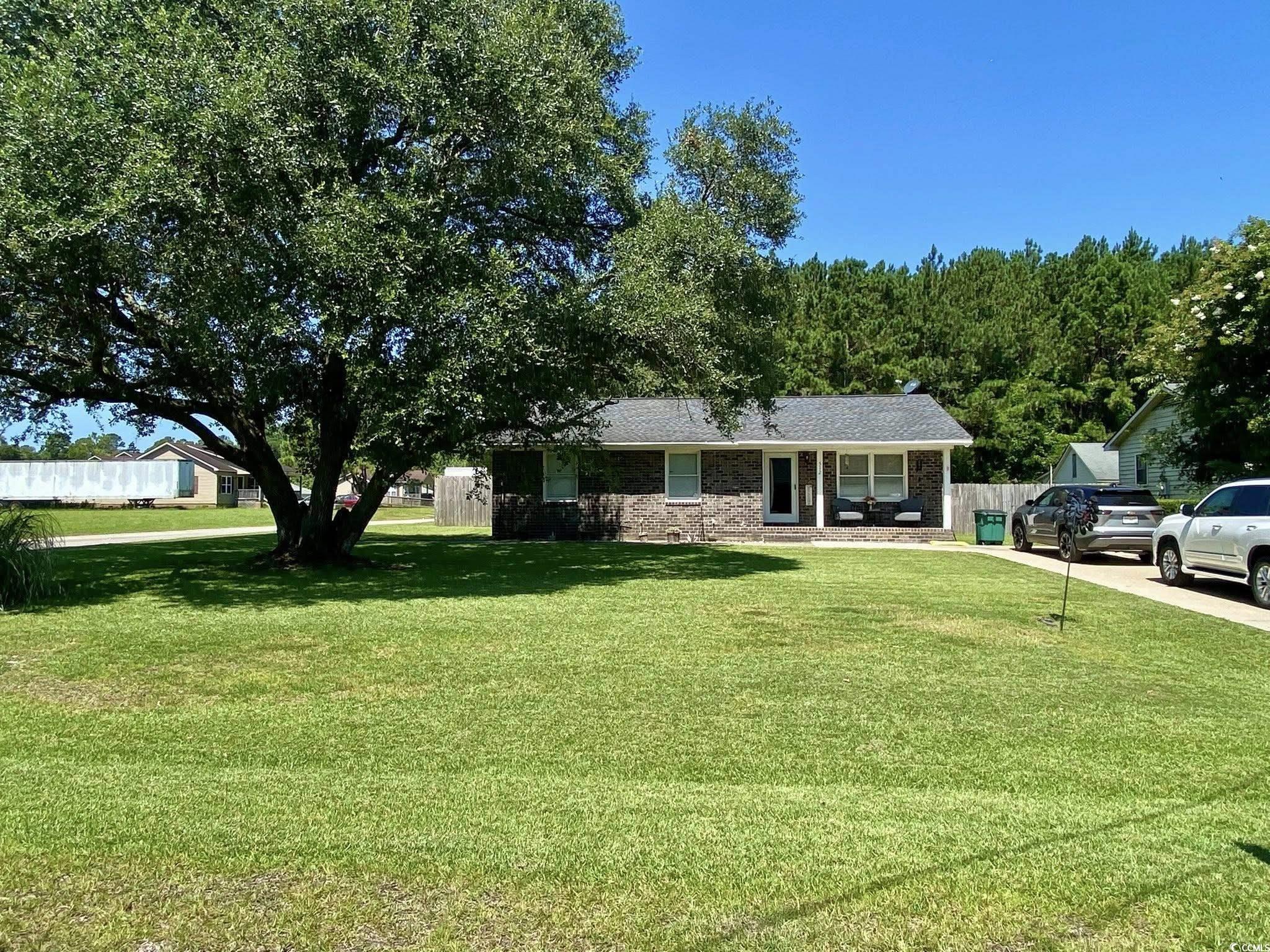 512 South Hazel Avenue Andrews, SC 29510 - Photo 2 of 15 View of front of home featuring brick siding and a