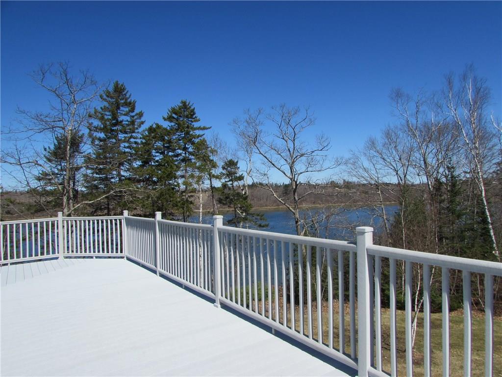 36 Hatch Cove Drive Castine, ME 04421 - Photo 6 of 28 View of the large deck and the cove
