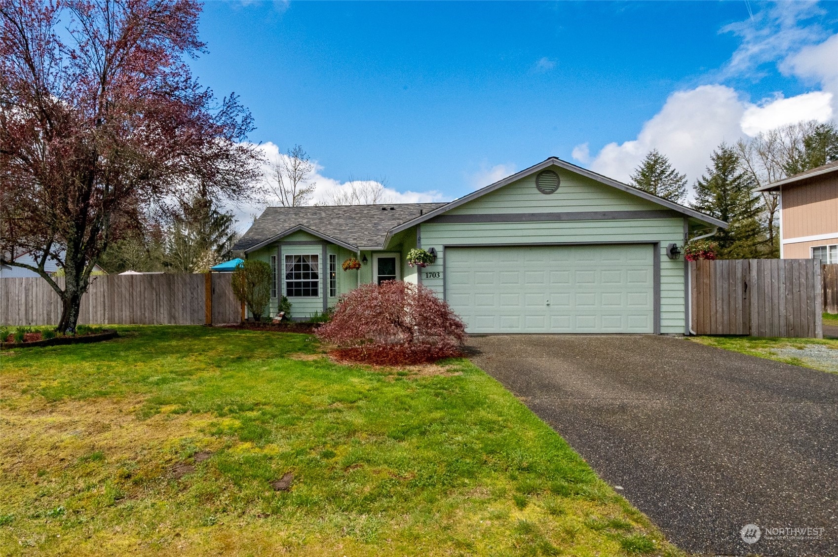1703 Gohr Road Sultan, WA 98294 - Photo 1 of 16 a front view of a house with a garden