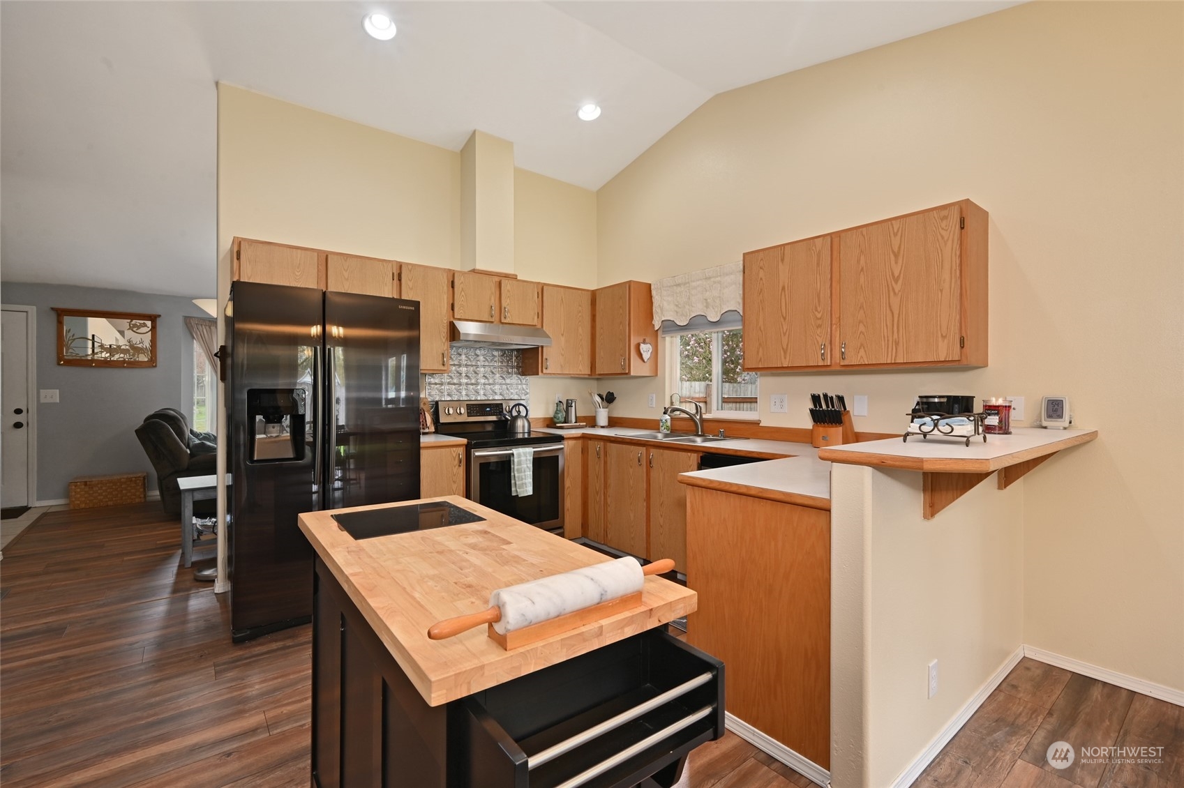 1703 Gohr Road Sultan, WA 98294 - Photo 3 of 16 a kitchen with a sink refrigerator and cabinets