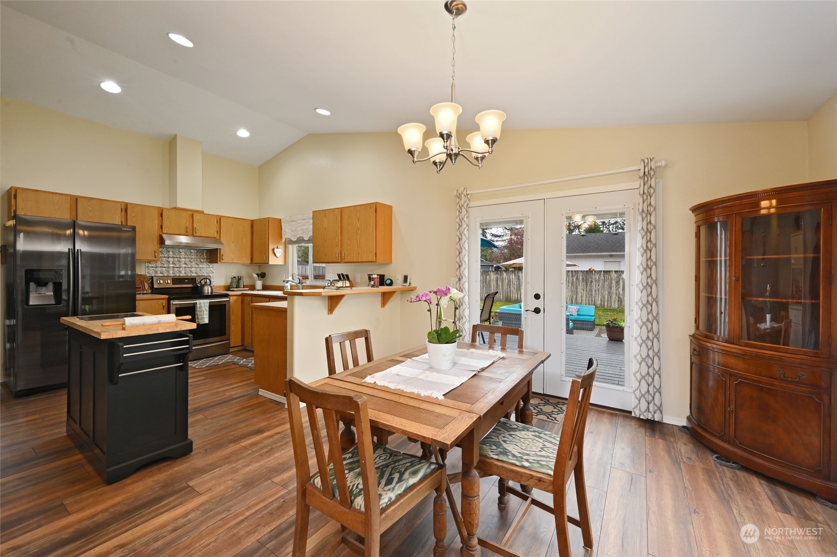 1703 Gohr Road Sultan, WA 98294 - Photo 5 of 16 a view of a dining room with furniture a chandelier and wooden floor