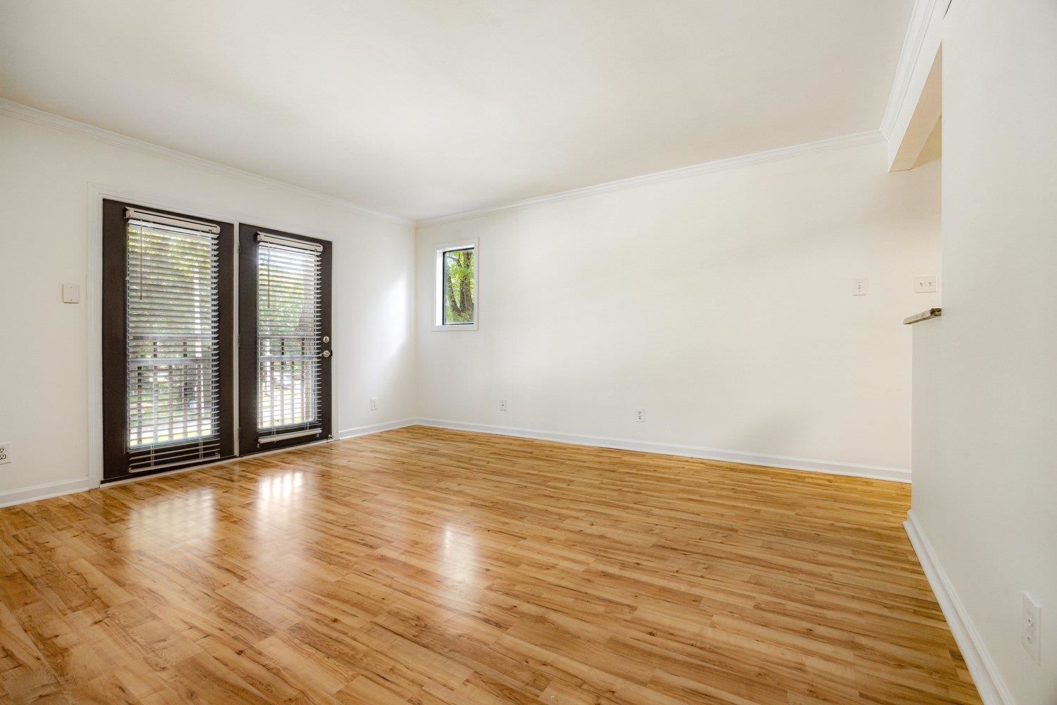 1847 Gray Ridge Cove, Unit 2 Germantown, TN 38138 - Photo 15 of 26 Spare room featuring crown molding, light wood-style flooring, and baseboards