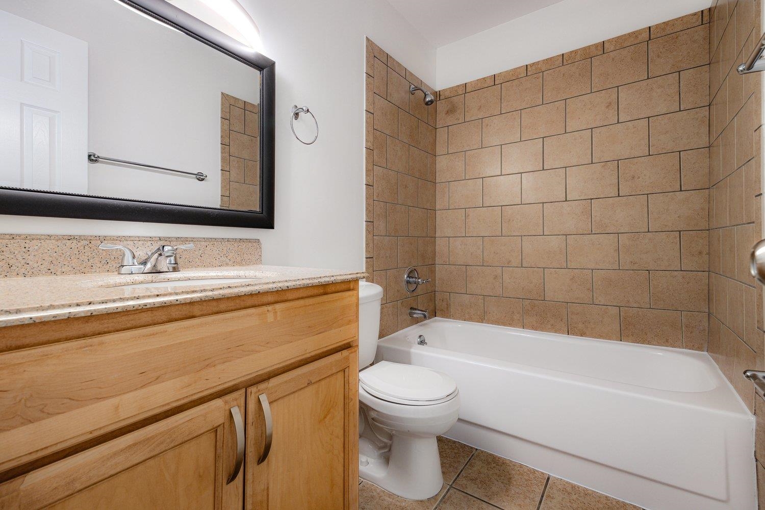 1847 Gray Ridge Cove, Unit 2 Germantown, TN 38138 - Photo 18 of 26 Full bath with toilet, vanity, shower combination, and tile patterned floors