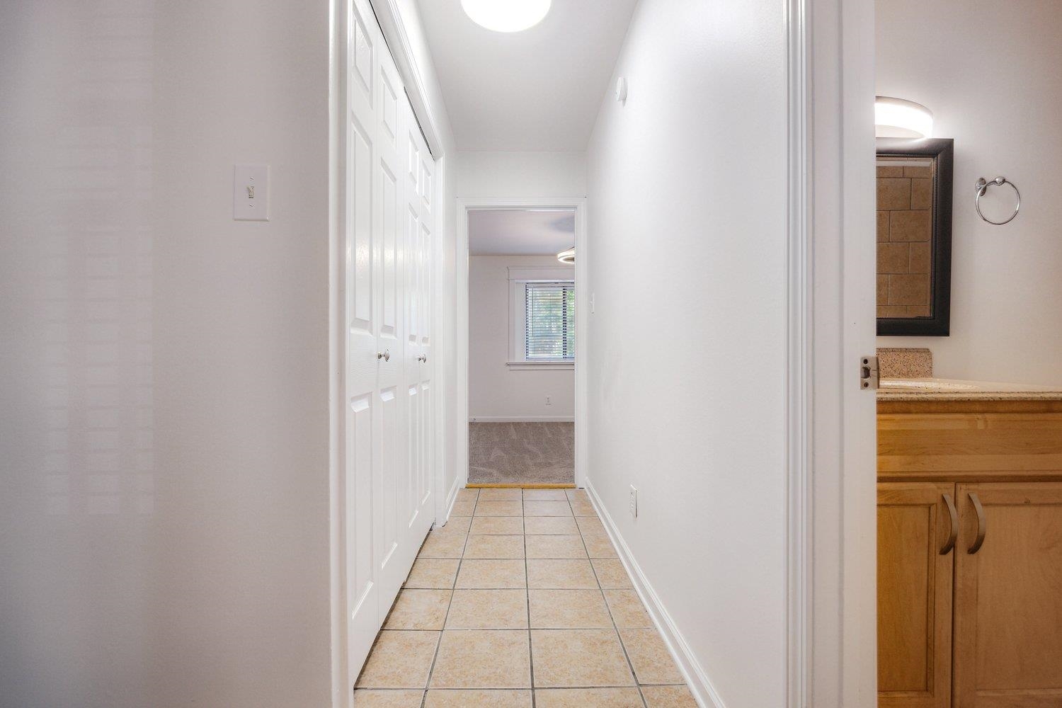 1847 Gray Ridge Cove, Unit 2 Germantown, TN 38138 - Photo 19 of 26 Hallway with light tile patterned flooring and baseboards