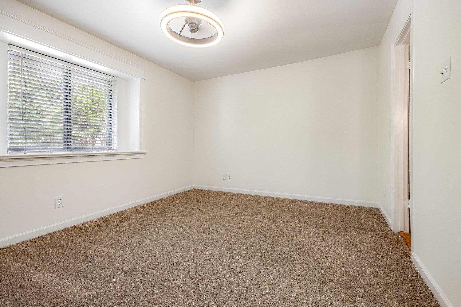 1847 Gray Ridge Cove, Unit 2 Germantown, TN 38138 - Photo 20 of 26 Spare room featuring carpet and baseboards