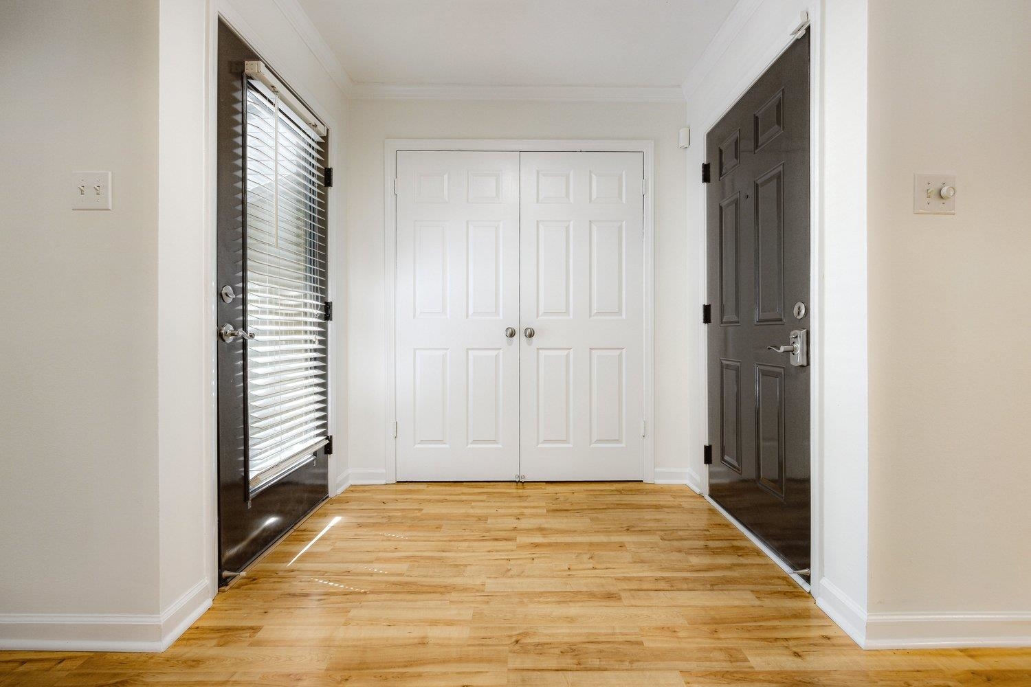 1847 Gray Ridge Cove, Unit 2 Germantown, TN 38138 - Photo 10 of 24 Corridor featuring light wood finished floors, ornamental molding, and baseboards