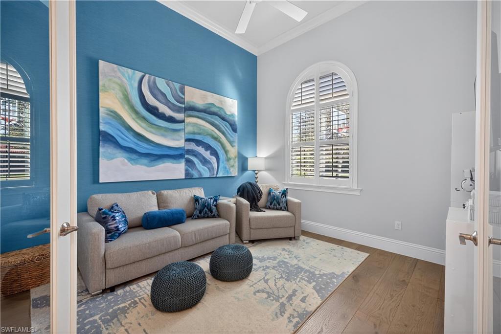 7405 Acorn Way Naples, FL 34119 - Photo 15 of 50 a living room with furniture and a window