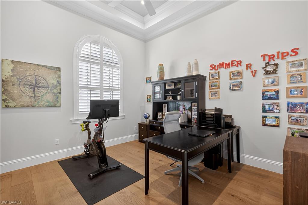 7405 Acorn Way Naples, FL 34119 - Photo 16 of 50 a view of a workspace with furniture and a window