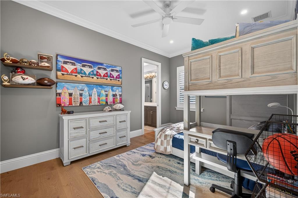 7405 Acorn Way Naples, FL 34119 - Photo 24 of 50 a bedroom with furniture and a window