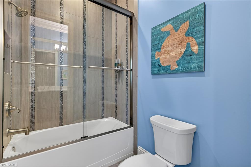 7405 Acorn Way Naples, FL 34119 - Photo 28 of 50 a bathroom with a toilet and a shower