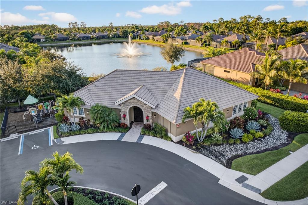 7405 Acorn Way Naples, FL 34119 - Photo 43 of 50 an aerial view of a house with a lake view