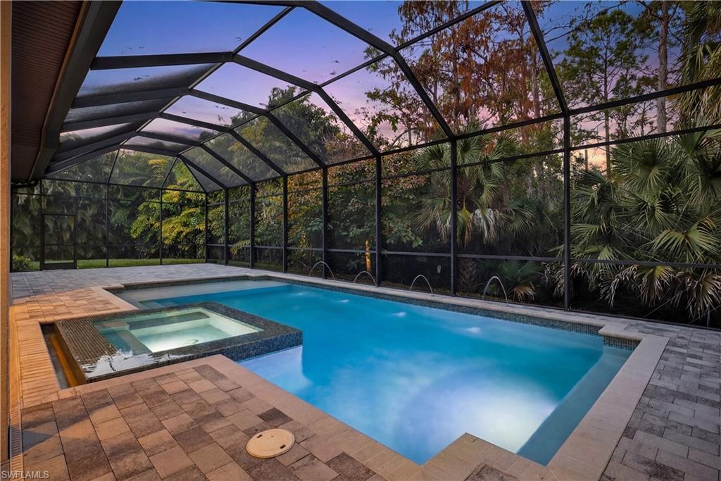 7405 Acorn Way Naples, FL 34119 - Photo 5 of 50 a view of a backyard with swimming pool