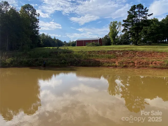 a view of a lake with a yard