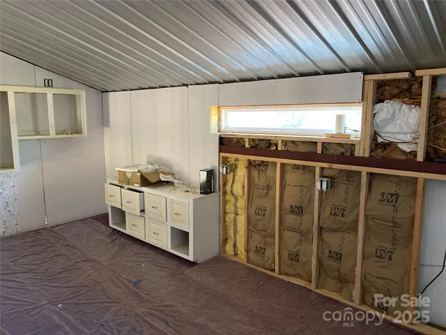 a kitchen with a sink cabinets and appliances