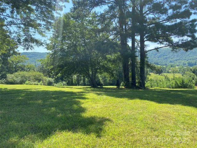 a view of a swimming pool with an outdoor space and seating area