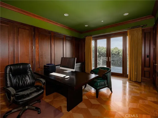 a livingroom with workspace couch and a window