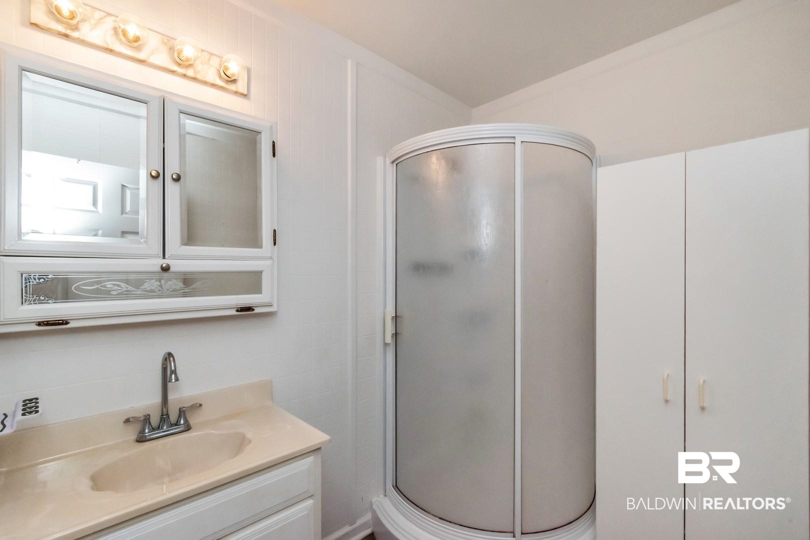 12751 Zanzibar Road Grand Bay, AL 36541 - Photo 18 of 30 Bathroom featuring a shower with shower door and vanity