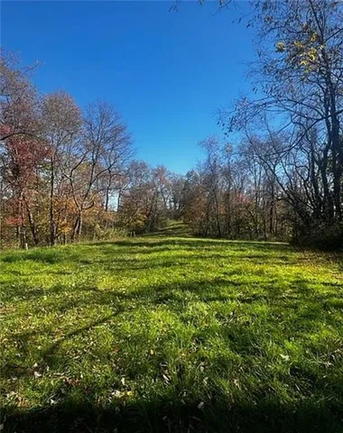 a view of outdoor space with deck and yard