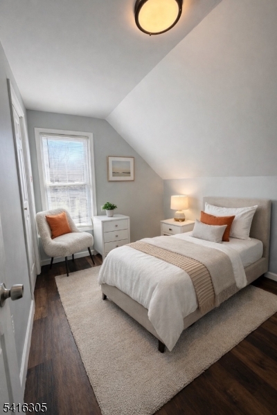 9 Oak Place Irvington, NJ 07111 - Photo 14 of 15 a bedroom with a bed and window