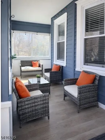 a outdoor living space with patio furniture and a potted plant