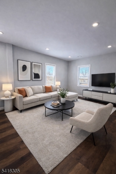 9 Oak Place Irvington, NJ 07111 - Photo 4 of 15 a living room with furniture and a flat screen tv