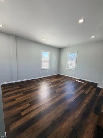 a view of room window and wooden floor