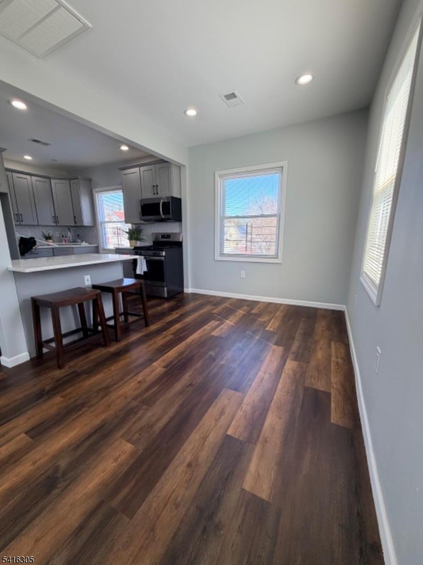 9 Oak Place Irvington, NJ 07111 - Photo 6 of 15 a view of kitchen with furniture wooden floor and window