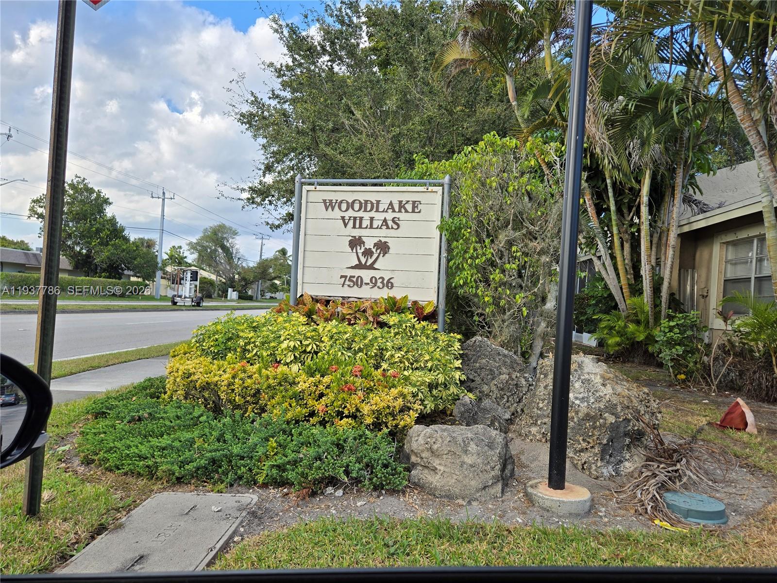 842 Banks Road Coconut Creek, FL 33063 - Photo 8 of 8 a sign on the side of the road