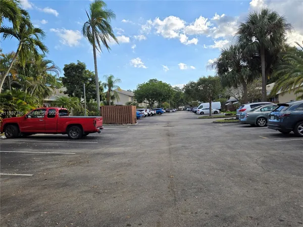 a view of street with parked cars