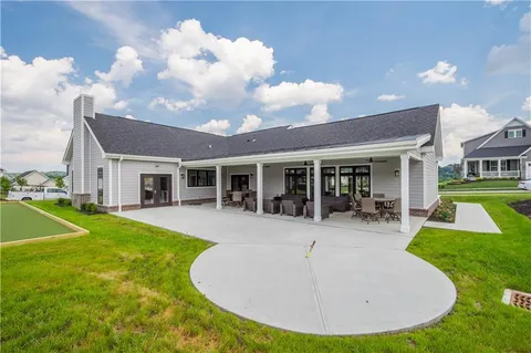 green aerial view of a swimming pool yard and mountain view