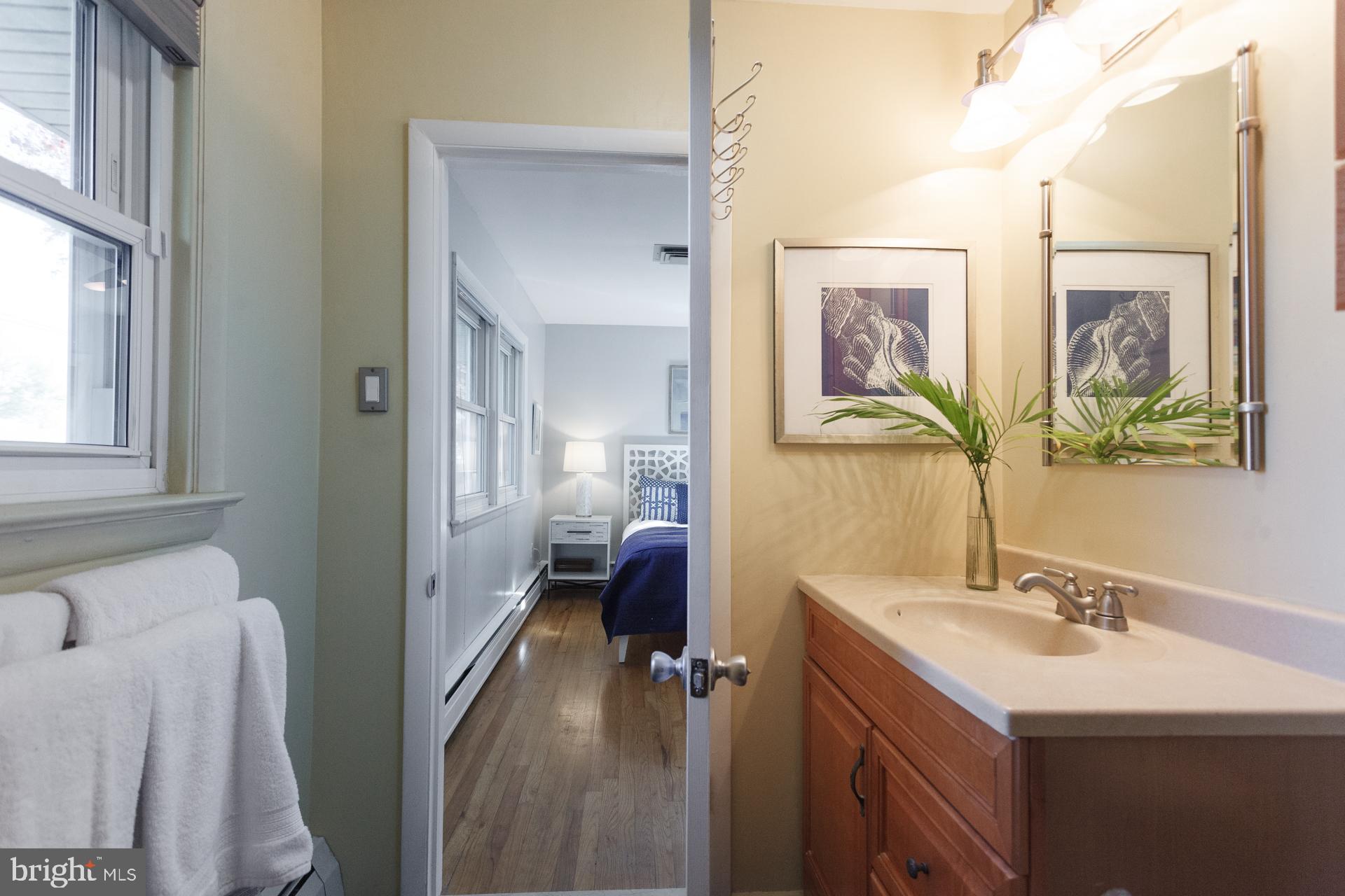 2017 Quarry Road Yardley, PA 19067 - Photo 15 of 37 a en suite bathroom with a double vanity sink a mirror and a shower