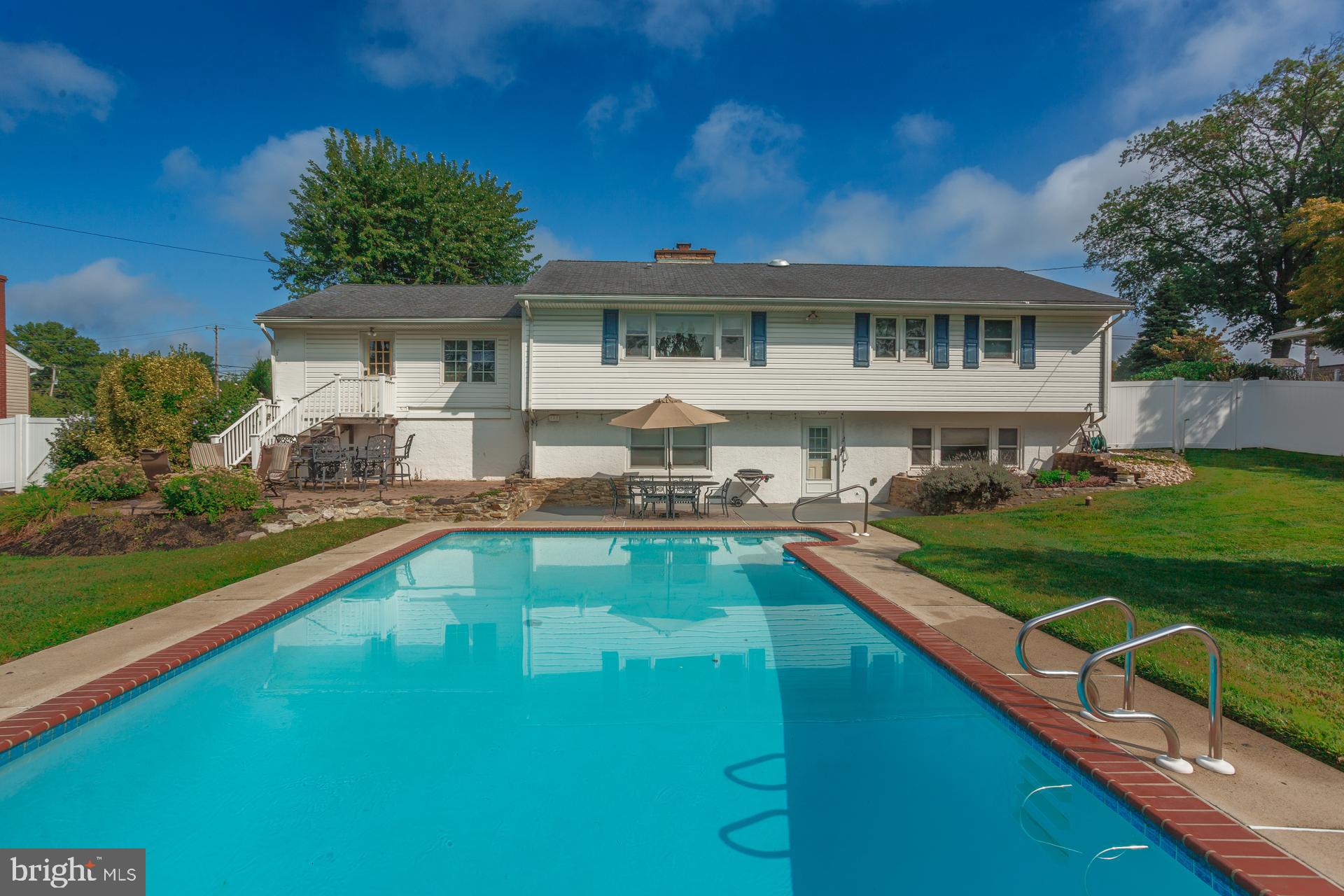 2017 Quarry Road Yardley, PA 19067 - Photo 32 of 37 a front view of a house with swimming pool having outdoor seating