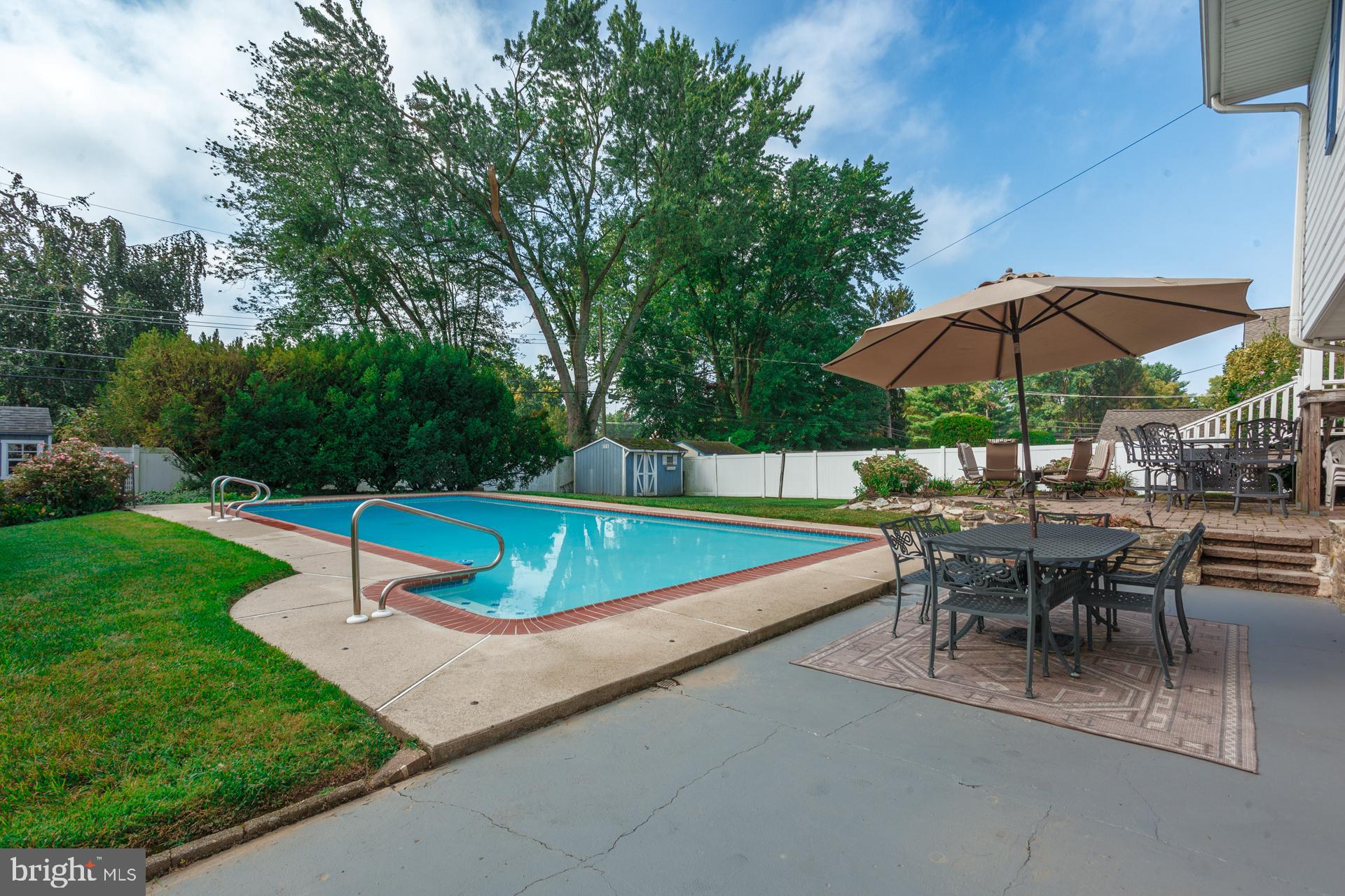 2017 Quarry Road Yardley, PA 19067 - Photo 34 of 37 a view of a patio with a table and chairs under an umbrella