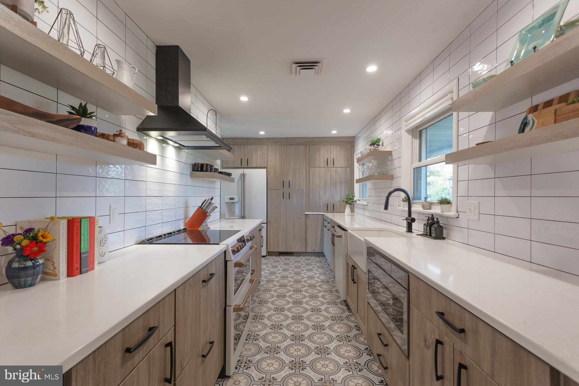 2017 Quarry Road Yardley, PA 19067 - Photo 4 of 37 a kitchen that has a lot of countertop cabinets a sink and wooden floor