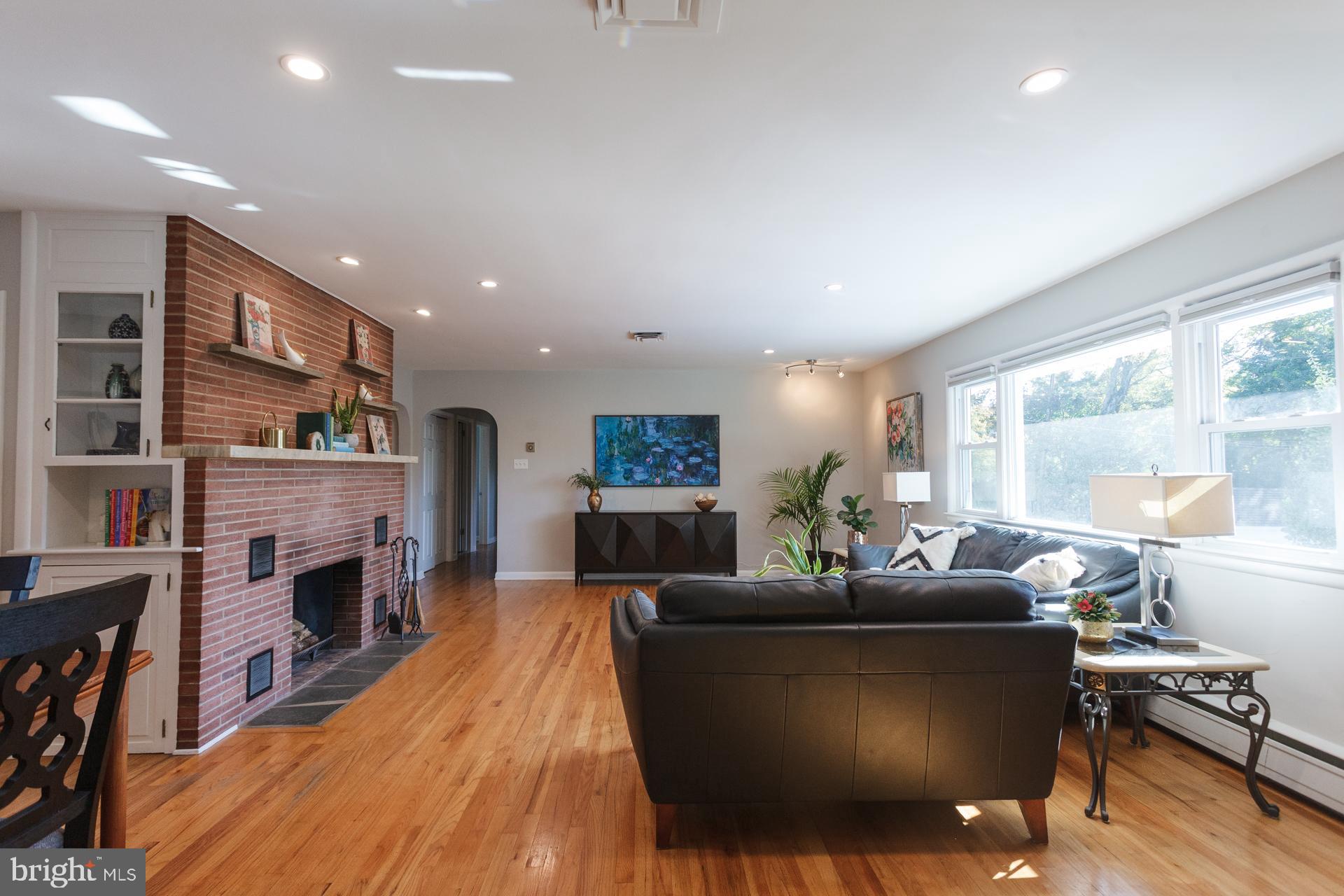 2017 Quarry Road Yardley, PA 19067 - Photo 7 of 37 a living room with fireplace furniture and a wooden floor