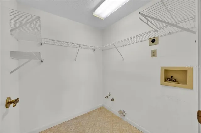 a spacious bathroom with a double vanity sink a mirror and a toilet